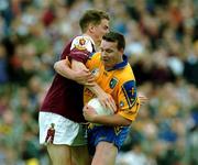 3 June 2001; Clifford McDonald of Roscommon is tackled by Michael Donnellan of Galway during the Bank of Ireland Connacht Senior Football Championship Semi-Final match between Galway and Roscommon at Tuam Stadium in Tuam, Galway. Photo by Damien Eagers/Sportsfile