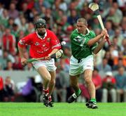 27 May 2001; Clement Smith of Limerick in action against Ben O'Connor of Cork during the Guinness Munster Senior Hurling Championship Quarter-Final match between Cork and Limerick at Páirc Uí Chaoimh in Cork. Photo by Ray McManus/Sportsfile