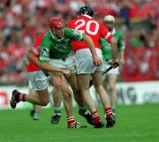27 May 2001; Ollie Moran of Limerick is tackled by Brian Corcoran of Cork during the Guinness Munster Senior Hurling Championship Quarter-Final match between Cork and Limerick at Páirc Uí Chaoimh in Cork. Photo by Ray McManus/Sportsfile