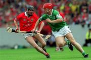 27 May 2001; Ollie Moran of Limerick is tackled by Pat Mulcahy of Cork during the Guinness Munster Senior Hurling Championship Quarter-Final match between Cork and Limerick at Páirc Uí Chaoimh in Cork. Photo by Ray McManus/Sportsfile
