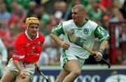 27 May 2001; Timmy Houlihan of Limerick in action against Joe Deane of Cork during the Guinness Munster Senior Hurling Championship Quarter-Final match between Cork and Limerick at Páirc Uí Chaoimh in Cork. Photo by Ray McManus/Sportsfile