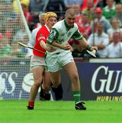 27 May 2001; Timmy Houlihan of Limerick in action against Joe Deane of Cork during the Guinness Munster Senior Hurling Championship Quarter-Final match between Cork and Limerick at Páirc Uí Chaoimh in Cork. Photo by Ray McManus/Sportsfile