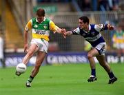 27 May 2001; Colm Quinn of Offaly in action against Aidan Fennelly of Laois during the Bank of Ireland Leinster Senior Football Championship Quarter-Final match between Offaly and Laois at Croke Park in Dublin. Photo by Brendan Moran/Sportsfile