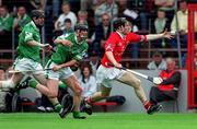 27 May 2001; Dave Moher of Cork in action against Donal O'Grady, centre, and Eugene Mulcahy of Limerick during the Guinness Munster Senior Hurling Championship Quarter-Final match between Cork and Limerick at Páirc Uí Chaoimh in Cork. Photo by Ray McManus/Sportsfile