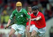 27 May 2001; Mark Tobin of Limerick in action against James Hughes of Cork during the Guinness Munster Senior Hurling Championship Quarter-Final match between Cork and Limerick at Páirc Uí Chaoimh in Cork. Photo by Ray McManus/Sportsfile
