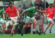 27 May 2001; PJ Garvey of Limerick in action against John O'Mahony of Cork during the Guinness Munster Senior Hurling Championship Quarter-Final match between Cork and Limerick at Páirc Uí Chaoimh in Cork. Photo by Ray McManus/Sportsfile