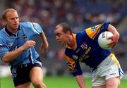 27 May 2001; Padraig Davis of Longford is tackled by Shane Ryan of Dublin during the Bank of Ireland Leinster Senior Football Championship Quarter-Final match between Dublin and Longford at Croke Park in Dublin. Photo by Pat Murphy/Sportsfile