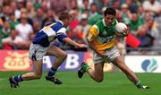 27 May 2001; Vinny Claffey of Offaly in action against Joseph Higgins of Laois during the Bank of Ireland Leinster Senior Football Championship Quarter-Final match between Offaly and Laois at Croke Park in Dublin. Photo by Brendan Moran/Sportsfile