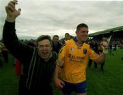3 June 2001; Seamus O'Neill of Roscommon celebrates with a supporter following his side's victory of the Bank of Ireland Connacht Senior Football Championship Semi-Final match between Galway and Roscommon at Tuam Stadium in Tuam, Galway. Photo by Damien Eagers/Sportsfile