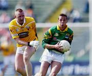 9 June 2001; Padraig McGarry of Leitrim in action against John Barr of Antrim during the Bank of Ireland All-Ireland Senior Football Championship Qualifier Round 1 match between Antrim and Leitrim at Casement Park in Belfast. Photo by Ray McManus/Sportsfile