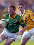 9 June 2001; Fergal Reynolds of Antrim in action against Paul Close of Leitrim during the Bank of Ireland All-Ireland Senior Football Championship Qualifier Round 1 match between Antrim and Leitrim at Casement Park in Belfast. Photo by Ray McManus/Sportsfile