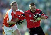9 June 2001; Brendan Coulter of Down in action against Tony McEntee of Armagh during the Bank of Ireland All-Ireland Senior Football Championship Qualifier Round 1 match between Down and Armagh at Casement Park in Belfast. Photo by Ray McManus/Sportsfile