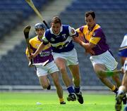 10 June 2001; Darren Rooney of Laois is tackled by Darragh Ryan of Wexford during the Guinness Leinster Senior Hurling Championship Semi-Final match between Wexford and Laois at Croke Park in Dublin. Photo by Ray McManus/Sportsfile
