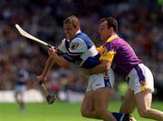 10 June 2001; Darren Rooney of Laois is tackled by Darragh Ryan of Wexford during the Guinness Leinster Senior Hurling Championship Semi-Final match between Wexford and Laois at Croke Park in Dublin. Photo by Pat Murphy/Sportsfile