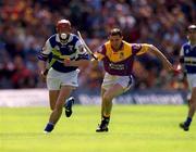 10 June 2001; Joe Phelan of Laois in action against Larry O'Gorman of Wexford during the Guinness Leinster Senior Hurling Championship Semi-Final match between Wexford and Laois at Croke Park in Dublin. Photo by Ray McManus/Sportsfile