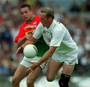 3 June 2001; Willie McCreery of Kildare is tackled by Joe Byrne of Carlow during the Bank of Ireland Leinster Senior Football Championship Quarter-Final match between Kildare and Carlow at Croke Park in Dublin. Photo by David Maher/Sportsfile