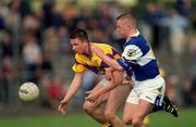 6 May 2001; Diarmuid Kinsella of Wexford in action against David Brennan of Laois during the Bank of Ireland Leinster Senior Football Championship First Round match between Laois and Wexford at Dr Cullen Park in Carlow. Photo by Aoife Rice/Sportsfile
