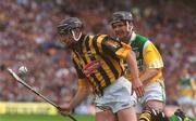10 June 2001; Eddie Brennan of Kilkenny in action against Hubert Rigney of Offaly during the Guinness Leinster Senior Hurling Championship Semi-Final match between Kilkenny and Offaly at Croke Park in Dublin. Photo by Pat Murphy/Sportsfile