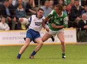 10 June 2001; Ciaran Tavey of Monaghan is tackled by Shaun Burns of Fermanagh during the Bank of Ireland Ulster Senior Football Championship Quarter-Final match between Fermanagh and Monaghan at Brewster Park in Enniskillen, Fermanagh. Photo by David Maher/Sportsfile