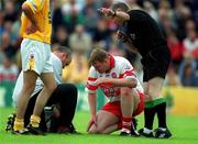 3 June 2001; Dermot Heaney of Derry is asked to leave the pitch, with a blood injury by referee Pat O'Toole, during the Bank of Ireland Ulster Senior Football Championship Quarter-Final match between Derry and Antrim at Celtic Park in Derry. Photo by Aoife Rice/Sportsfile