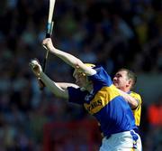 3 June 2001; Lar Corbett of Clare in action against Brian Quinn of Tipperary during the Guinness Munster Senior Hurling Championship Semi-Final match between Tipperary and Clare at Páirc Uí Chaoimh in Cork. Photo by Ray McManus/Sportsfile