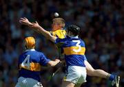 3 June 2001; Niall Gilligan of Clare in action against Philip Maher, 4, of Tipperary during the Guinness Munster Senior Hurling Championship Semi-Final match between Tipperary and Clare at Páirc Uí Chaoimh in Cork. Photo by Ray McManus/Sportsfile