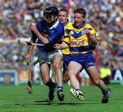 3 June 2001; Thomas Dunne of Tipperary in action against James O'Connor of Clare during the Guinness Munster Senior Hurling Championship Semi-Final match between Tipperary and Clare at Páirc Uí Chaoimh in Cork. Photo by Ray McManus/Sportsfile