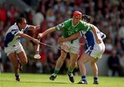 10 June 2001; Ollie Moran of Limerick in action against Peter Queally, left, and Sean Cullinane of Waterford during the Guinness Munster Senior Hurling Championship Semi-Final match between Limerick and Waterford at Páirc Uí Chaoimh in Cork. Photo by Brendan Moran/Sportsfile