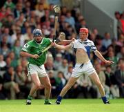 10 June 2001; Brian Geary of Limerick in action against John Mullane of Waterford during the Guinness Munster Senior Hurling Championship Semi-Final match between Limerick and Waterford at Páirc Uí Chaoimh in Cork. Photo by Brendan Moran/Sportsfile