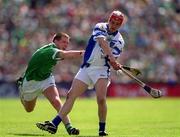 10 June 2001; Michael White of Waterford in action against Mark Foley of Limerick during the Guinness Munster Senior Hurling Championship Semi-Final match between Limerick and Waterford at Páirc Uí Chaoimh in Cork. Photo by Brendan Moran/Sportsfile