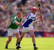 10 June 2001; Michael White of Waterford in action against Mark Foley of Limerick during the Guinness Munster Senior Hurling Championship Semi-Final match between Limerick and Waterford at Páirc Uí Chaoimh in Cork. Photo by Brendan Moran/Sportsfile