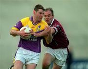 9 June 2001; Wexford's Pat Forde holds off the challenge of Westmeath's Ger Heavin. All-Ireland Football Championship Qualifier, Round 1, Wexford Park, Wexford. Picture credit; Brendan Moran / SPORTSFILE