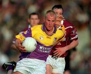 9 June 2001; Willie Carley of Wexford in action against Brian Morley of Westmeath during the Bank of Ireland All-Ireland Senior Football Championship Qualifier Round 1 match between Wexford and Westmeath at Wexford Park in Wexford. Photo by Brendan Moran/Sportsfile