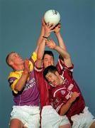 9 June 2001; Rory O'Connell, centre, of Westmeath catches a high-ball against Willie Carley of Wexford during the Bank of Ireland All-Ireland Senior Football Championship Qualifier Round 1 match between Wexford and Westmeath at Wexford Park in Wexford. Photo by Brendan Moran/Sportsfile