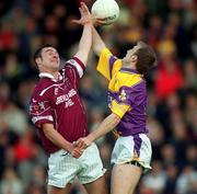 9 June 2001; Martin Flanagan of Westmeath in action against Philip Wallace of Wexford during the Bank of Ireland All-Ireland Senior Football Championship Qualifier Round 1 match between Wexford and Westmeath at Wexford Park in Wexford. Photo by Brendan Moran/Sportsfile