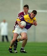 9 June 2001; Pat Forde of Wexford in action against Brian Morley of Westmeath during the Bank of Ireland All-Ireland Senior Football Championship Qualifier Round 1 match between Wexford and Westmeath at Wexford Park in Wexford. Photo by Brendan Moran/Sportsfile