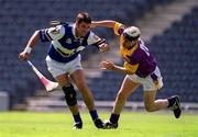 10 June 2001; Paul Cuddy of Laois in action against Ken Furlong of Wexford during the Guinness Leinster Senior Hurling Championship Semi-Final match between Wexford and Laois at Croke Park in Dublin. Photo by Ray McManus/Sportsfile