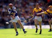 10 June 2001; Joe Phelan of Laois in action against Michael Jordan and Larry O'Gorman of Wexford during the Guinness Leinster Senior Hurling Championship Semi-Final match between Wexford and Laois at Croke Park in Dublin. Photo by Ray McManus/Sportsfile