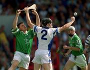 10 June 2001; Barry Foley of Limerick in action against Tom Feeney of Waterford during the Guinness Munster Senior Hurling Championship Semi-Final match between Limerick and Waterford at Páirc Uí Chaoimh in Cork. Photo by Brendan Moran/Sportsfile
