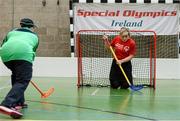 21 April 2016; Cork camogie legend Anna Geary tries her hand at floorball at a Special Olympics Winter Sports event in Dublin. Anna and the Women’s Gaelic Players Association have thrown their support behind Special Olympics on their charity Collecion Day, which is proudly sponsored by eir. Collection Day takes place nationwide on Friday the 22nd of April. 3,000 volunteers, including many WGPA players and eir employees, will be out in force in villages, towns and cities around Ireland trying to help the sports charity raise €650,000 in just 24 hours. Pictured with Anna Geary is Connacht Special Olympic athlete Aine Naughton. Kilternan Ski Slope & Loughlinstown Activity Centre, Kilternan, Dublin. Picture credit: Sam Barnes / SPORTSFILE