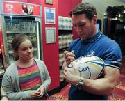 20 April 2016; Leinster's Isaac Boss signs a rugby ball for Katie Parle, age 12, from Wexford, at The Jungle Book at Movies@Dundrum as Leinster Rugby hosted A Night at the Movies in aid of The Alzheimer Society of Ireland. The event was held in support of one of the Leinster Rugby charity partners, The Alzheimer Society of Ireland, and the private ticket only event was used to raise funds for the charity. The Alzheimer Society of Ireland is the leading dementia specific service provider in Ireland and works across the country in the heart of local communities providing dementia specific services and supports and advocating for the rights and needs of all people living with dementia and their carers. It is a national non-profit organisation and also operates the Alzheimer National Helpline offering information and support to anyone affected by dementia. Check out www.alzheimer.ie<http://www.alzheimer.ie> for more information. Dundrum Cinema, Dundrum, Dublin. Picture credit: Seb Daly / SPORTSFILE