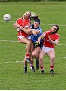23 April 2016; Niamh McEvoy, Dublin, is tackled by Brid Stack, left, and Marie Ambrose, Cork. Lidl Ladies Football National League, Division 1, semi-final, Cork v Dublin. St Brendan's Park, Birr, Co. Offaly. Picture credit: Ramsey Cardy / SPORTSFILE