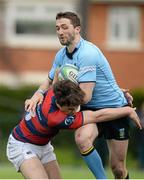 23 April 2016; Barry Daly, UCD, is tackled by Conor O'Brien, Clontarf. Ulster Bank League, Division 1A, semi-final, Clontarf v UCD. Castle Avenue, Clontarf, Co. Dublin. Picture credit: Cody Glenn / SPORTSFILE