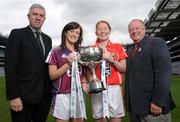 4 May 2010; Captain’s from teams competing in the Bord Gáis Energy NFL Divisions finals gathered in Croke ahead of the finals Park in Parnell Park on Saturday. Pictured are Galway's Emer Flaherty and Cork's Rena Buckley with Ger Cunningham, Bord Gáis Energy Sport Sponsorship Manager, and Ladies Gaelic Football Association President Pat Quill, right. Croke Park, Dublin. Photo by Sportsfile