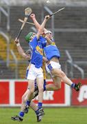 5 May 2010; Cathal Horan, left, and Niall O'Meara, Tipperary, in action against Enda Boyce, Clare. ESB GAA Munster Minor Hurling Championship Semi-Final Playoff, Tipperary v Clare, Cusack Park, Ennis, Co. Clare. Picture credit: Diarmuid Greene / SPORTSFILE