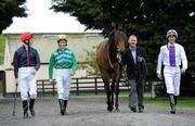6 May 2010; Retired top flat jockey Michael Kinane with race horse Haralan and jockeys, from left to right, Fran Berry, Pat Smullen and Kevin Manning after he was announced as Horse Racing Ireland's flat ambassador for 2010. John Oxx’s Curraghbeg Yard, Curragh, Co. Kildare. Picture credit: Matt Browne / SPORTSFILE