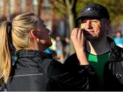 24 April 2016; Breda Somers from Dublin paints the tricolour on her husband Barry's cheeks ahead of the Dublin Remembers 1916 5K run. Mountjoy Square Park, Dublin.  Picture credit: Sam Barnes / SPORTSFILE