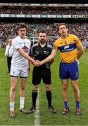 23 April 2016; Captains David Hyland, Kildare, and Gary Brennan, Clare, shake hands accross referee Noel Mooney before the game. Allianz Football League, Division 3, Final, Clare v Kildare. Croke Park, Dublin. Picture credit: Ray McManus / SPORTSFILE