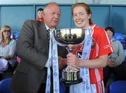 8 May 2010; Pat Quill, President, Cumann Peil Gael na mBan, presents Cork captain Rena Buckley with the cup. Bord Gais Energy Ladies National Football League Division 1 Final, Cork v Galway, Parnell Park, Dublin. Picture credit: Stephen McCarthy / SPORTSFILE