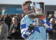 26 April 2016; Paddy Brennan celebrates with the Blessington Cup after winning the BoyleSports Champion Steeplechase on God's Own. Punchestown, Co. Kildare. Picture credit: Seb Daly / SPORTSFILE